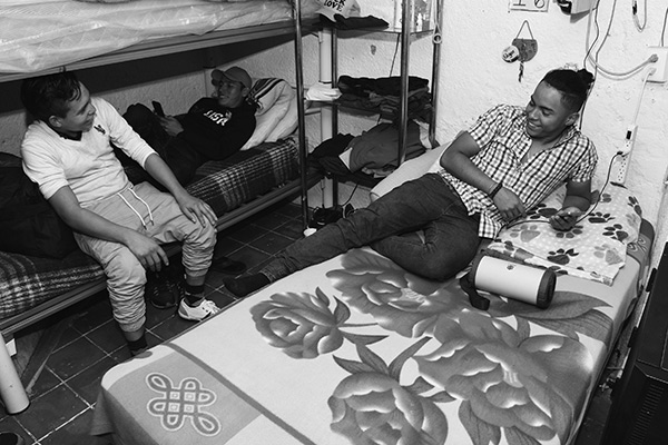 three men talking and laughing