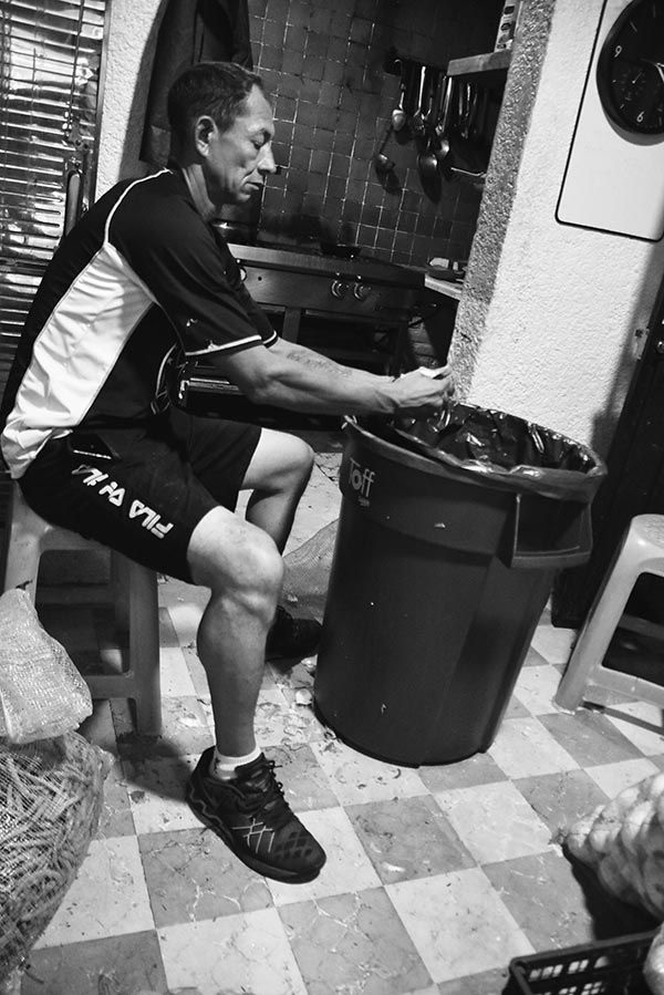 a man peeling potatoes