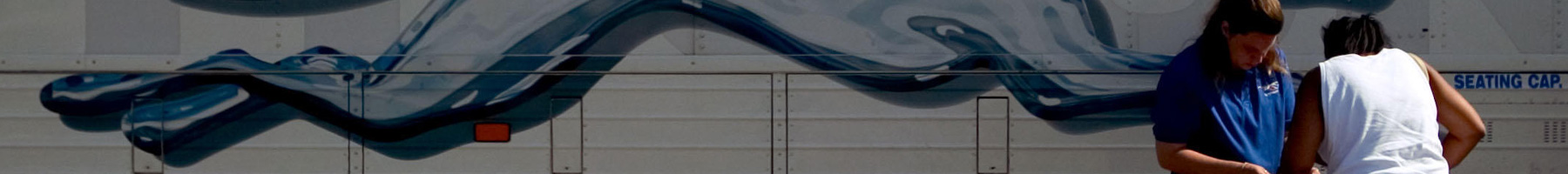 a passenger boarding a Greyhound bus