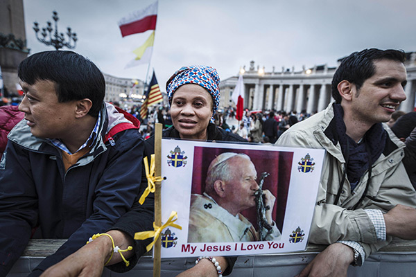 people standing near the Vatican