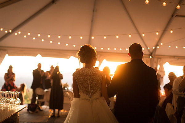 Bride and groom entering reception