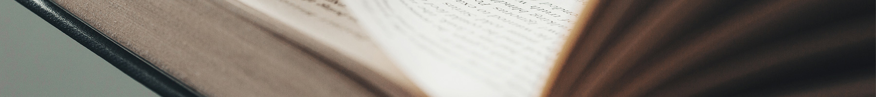 Young man opening and reading a book