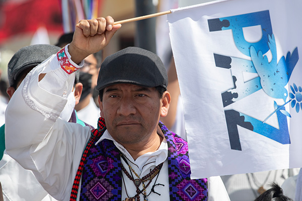 a man carrying a white flag