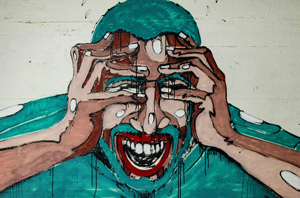 painting of a man covering his face with his hands