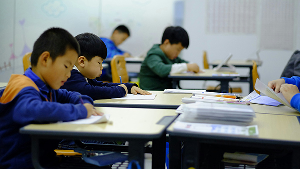 students taking a test in a classroom