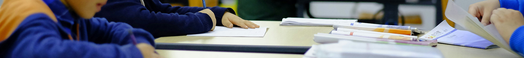 students taking a test in a classroom