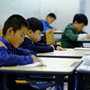 students taking a test in a classroom