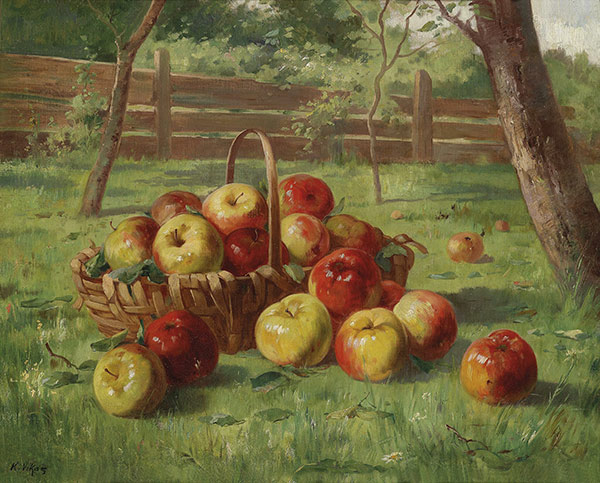 basket of apples in an orchard