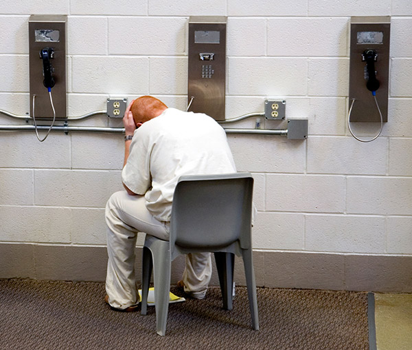 a prisoner making a phone call