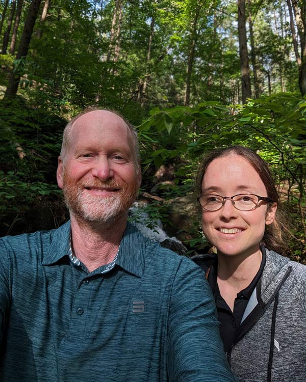 a father and daughter smiling