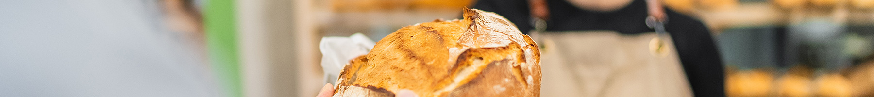 a woman selling sourdough bread