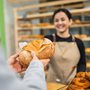 a woman selling sourdough bread