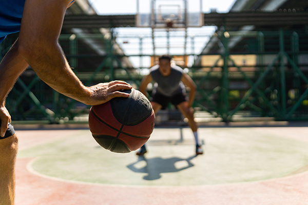 two guys playing basketball