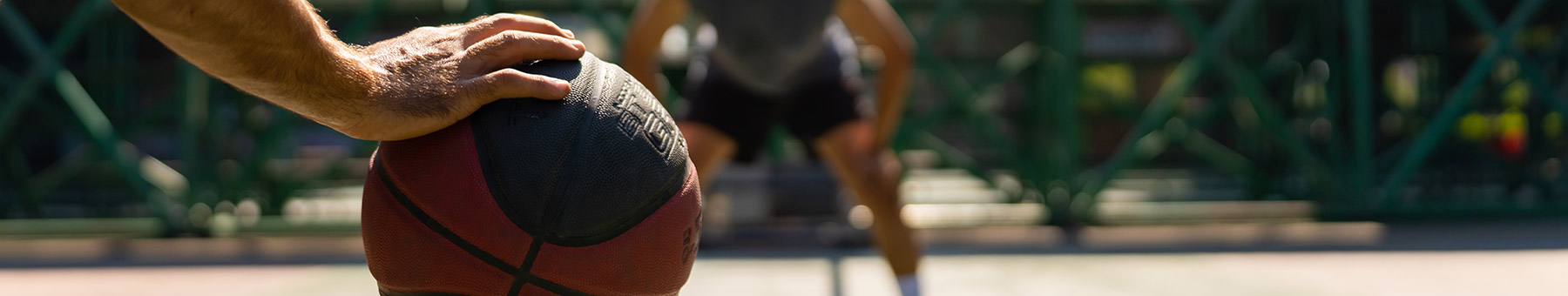 two guys playing basketball