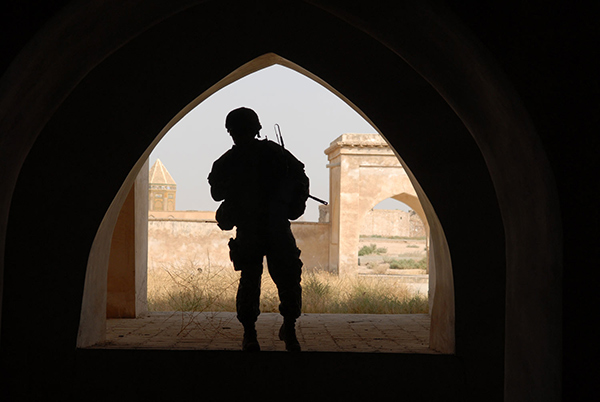 silhouette of an American soldier in a doorway in Iraq