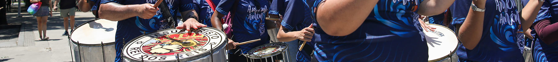 a samba band marching on a street