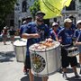 a samba band marching on a street