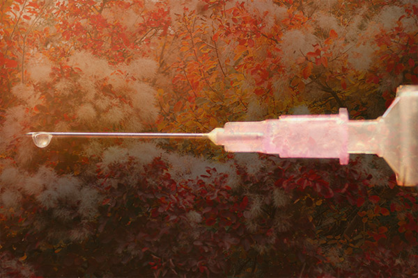 botox needle on a leaf covered background