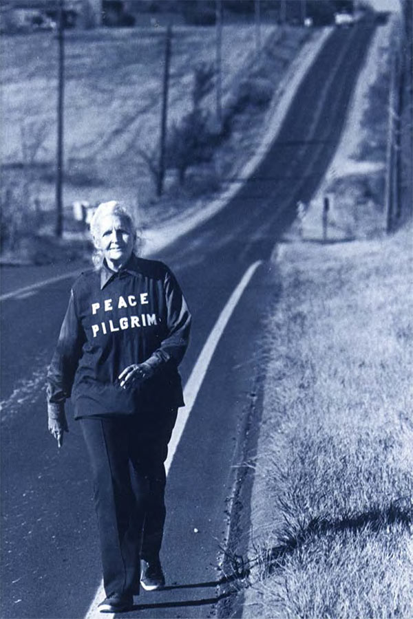 Peace Pilgrim walking down a country road