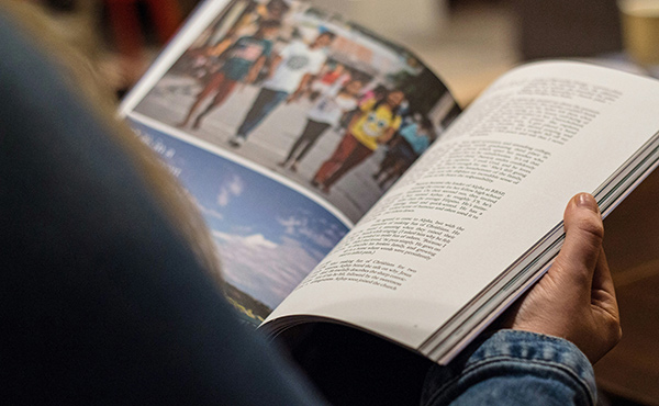 a person reading a magazine