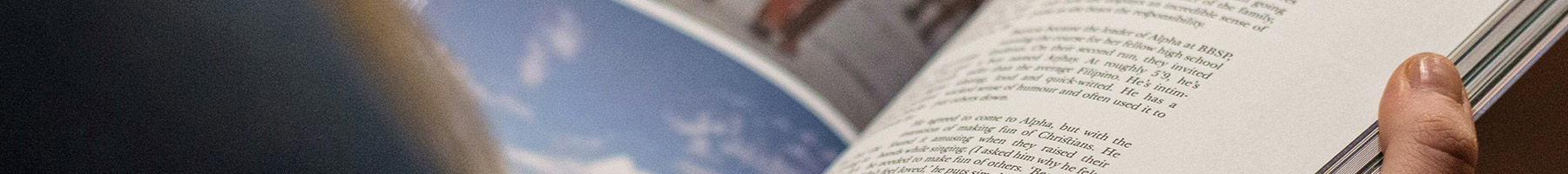 a person reading a magazine