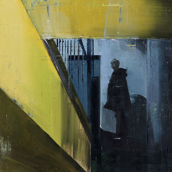 a man looking up a stairwell