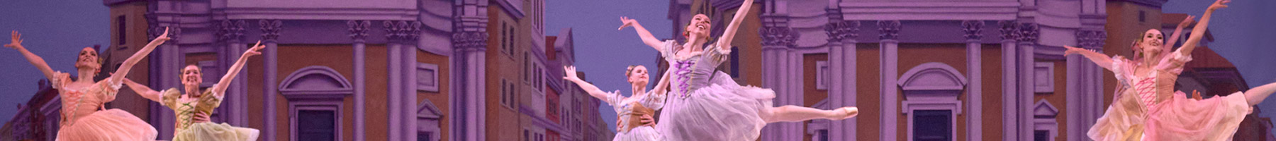 ballet dancers performing on a stage