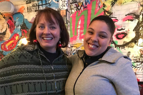 a mentor posing with her mentee