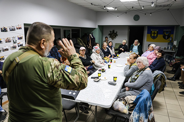 a chaplain speaking to a group of people