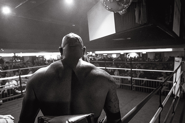muscular man standing in a boxing ring