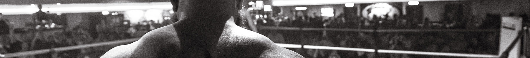 muscular man standing in a boxing ring