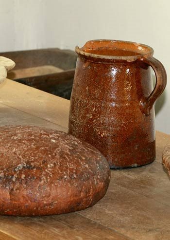 dark brown bread and jug and basket