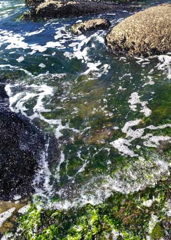 Small wave on a gravel beach