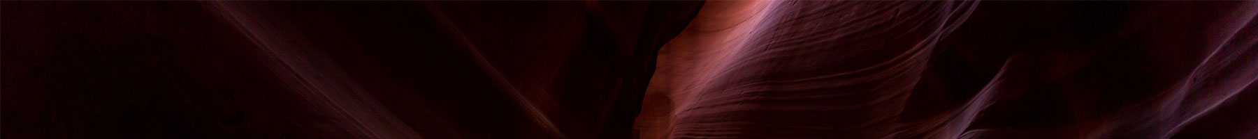 light shining on mauve rocks in Antelope Canyon in Arizona