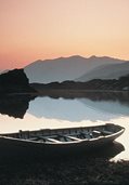 rowboat on a lake in the mountains