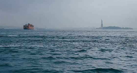The Statue of Liberty, seen from across the waters of New York's Upper Bay.