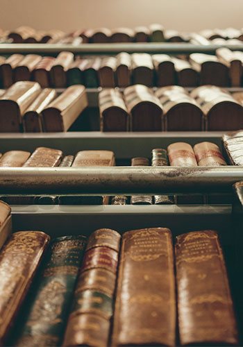 view of a shelf of books from below