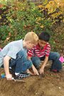 two boys digging