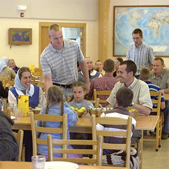 members of a Bruderhof community at a communal meal
