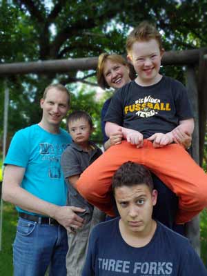 a couple and three boys