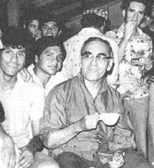 Oscar Romero talking with teenagers