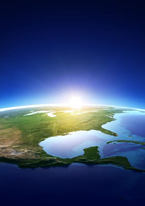 the sun rising over the earth