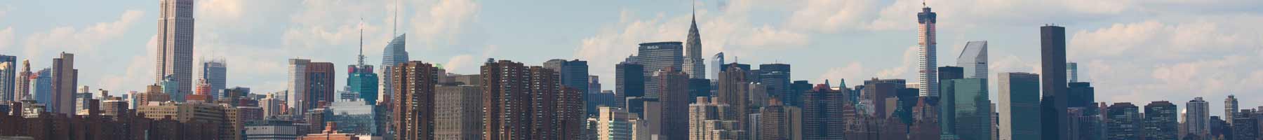 the New York City skyline with blue sky behind