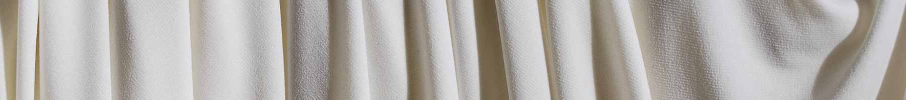 white fabric in folds