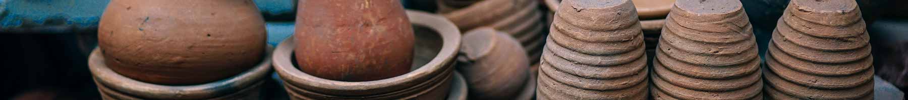 several brown pottery jars