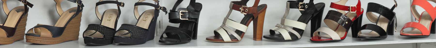 a shelf of high-heeled sandals in various colors