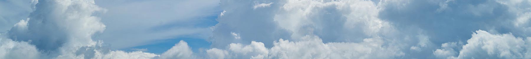 blue sky with white puffy clouds background texture