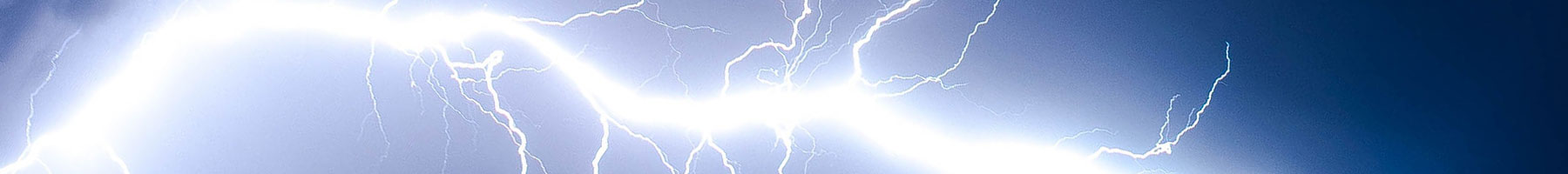 a white lightning bolt against a dark blue sky
