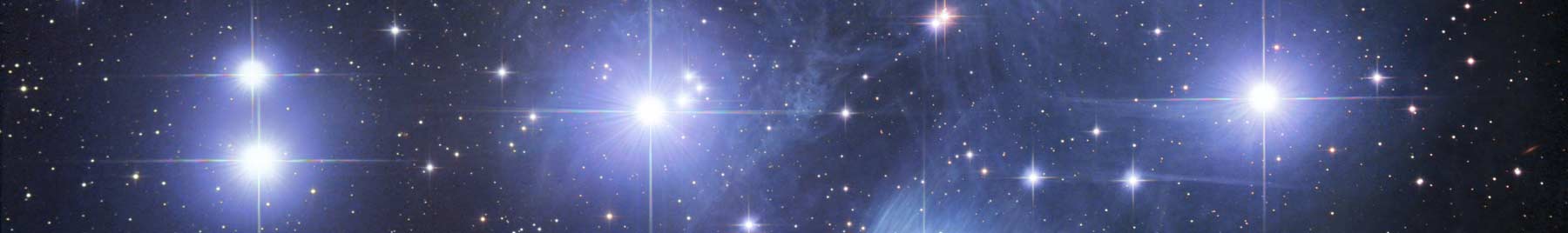 white an blue stars in a black sky: Pleiades star cluster
