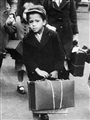 A small boy carrying his luggage as he left London for the country with a party of other evacuees on July 5, 1940.